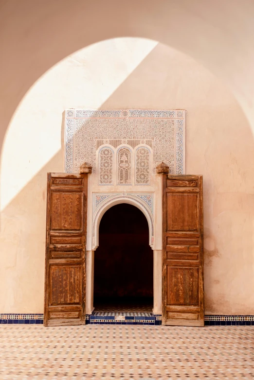 a doorway between two walls with carvings inside