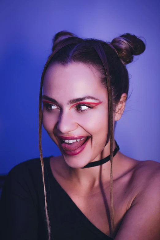 a woman wearing an evil choker and smiling