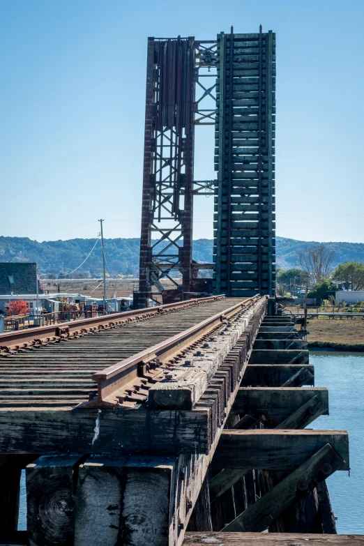 the view of an old bridge over water