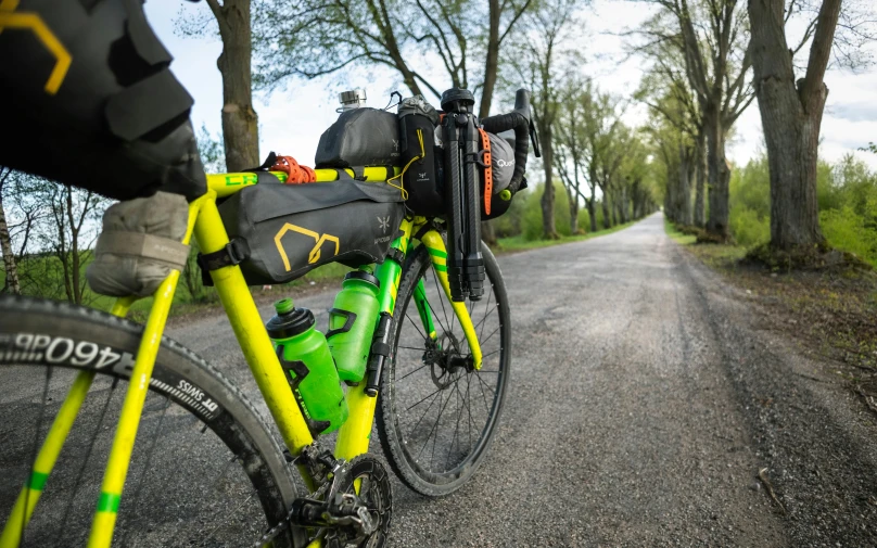 the bicycle is parked at the side of the road