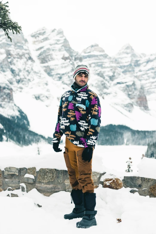 a man that is standing in the snow wearing his skis