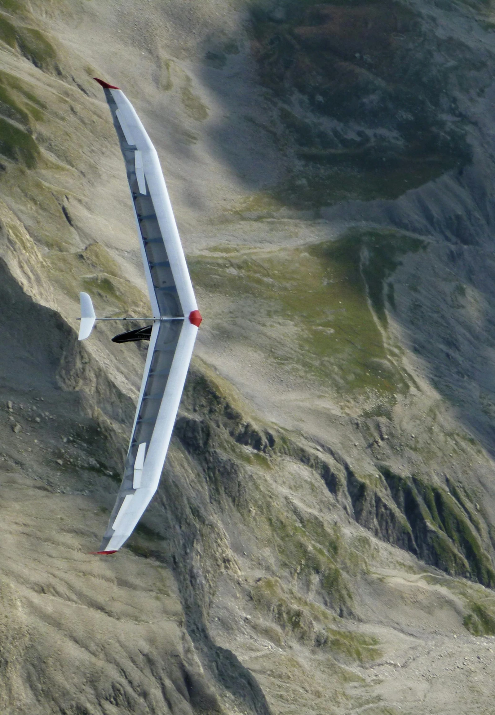 the aerial view of a glider's tail from above