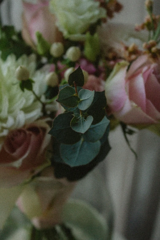 a bouquet of flowers that are sitting on top of a table