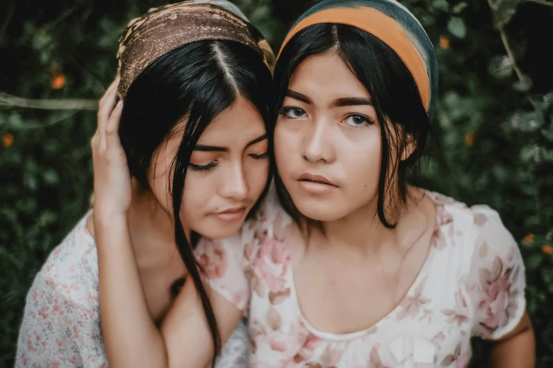 two young women posing together for a po