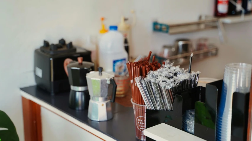 a bathroom vanity counter covered in lots of hair products