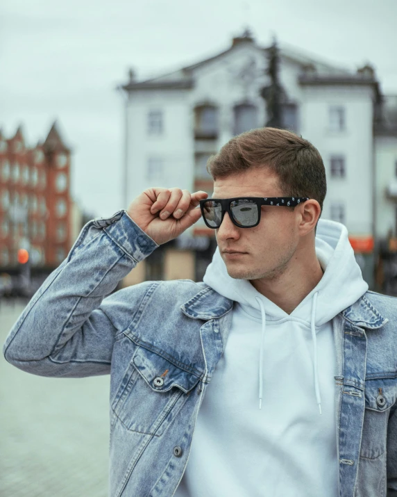 young man in sunglasses, looking to the side