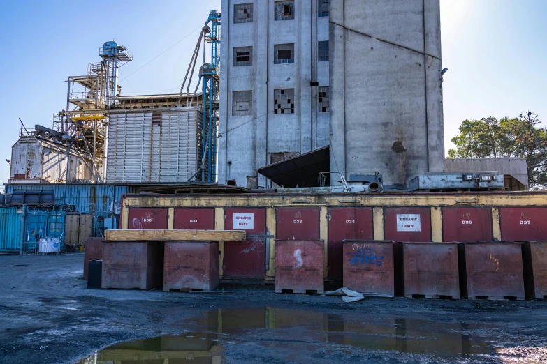 large building being demolished by crane and other construction