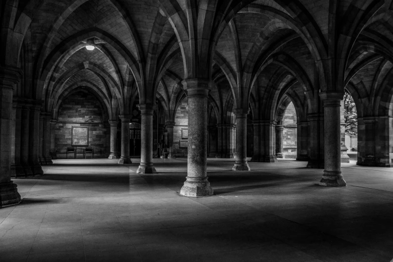 an empty cathedral has large arches and columns