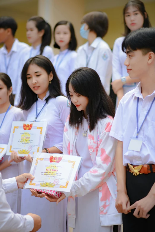 a group of students with white shirts and ties