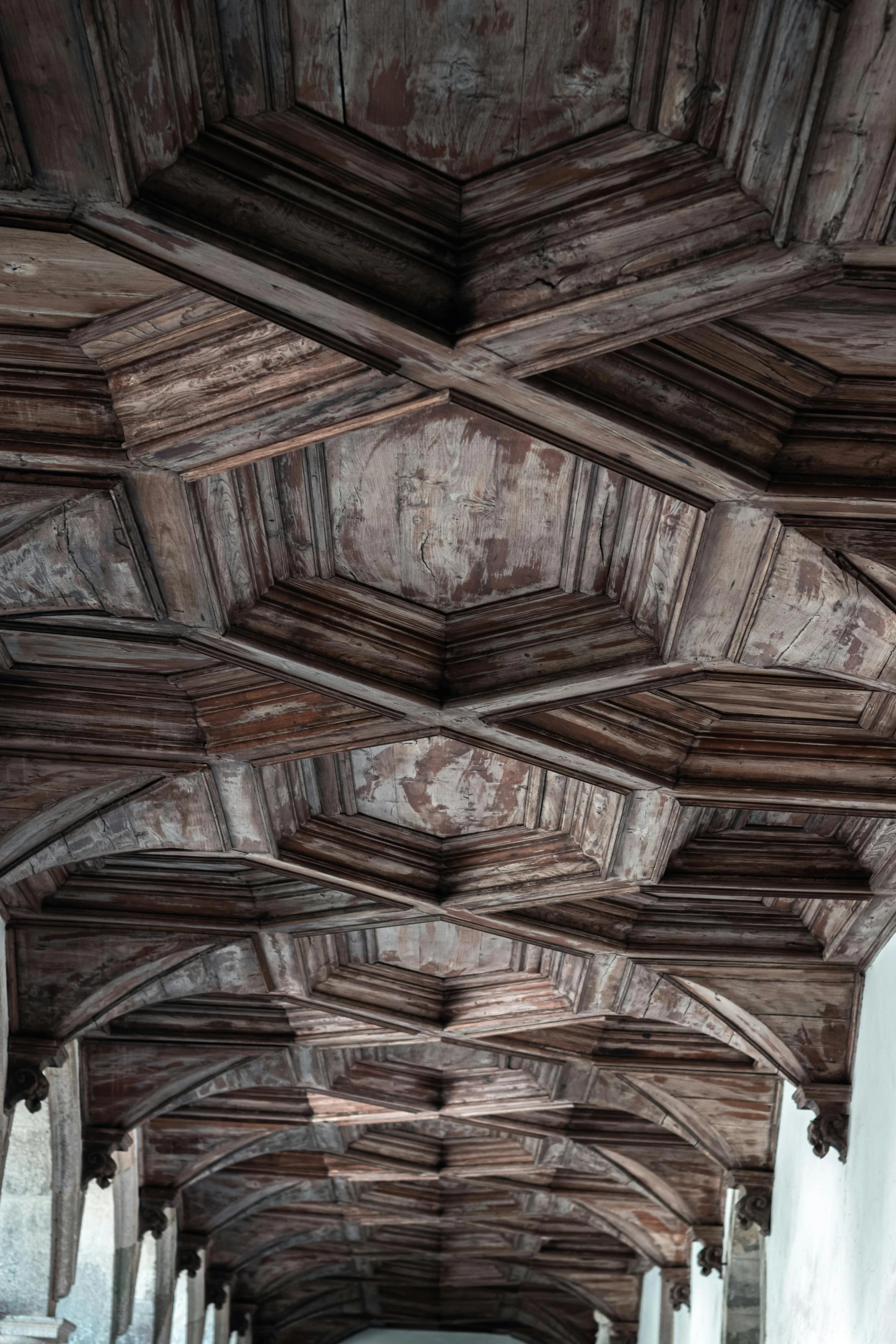 an old building with wooden carvings on it