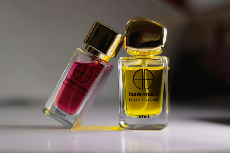 a close up of two bottles of perfume