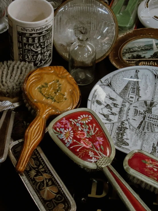 a collection of plates, bowls and spoons are shown