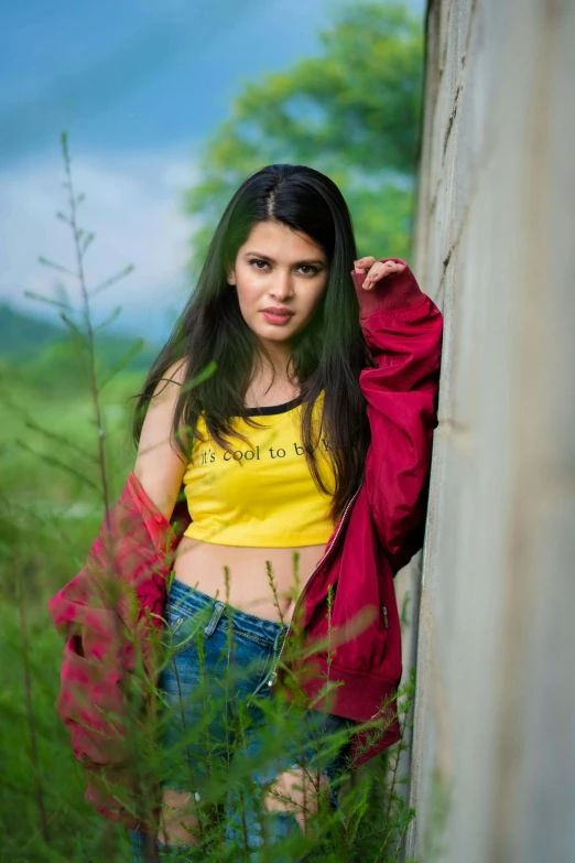 a woman with long hair posing for a po