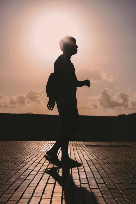 a person is walking across a stone walkway