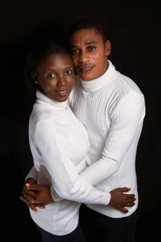 two african american women cuddling each other in a studio