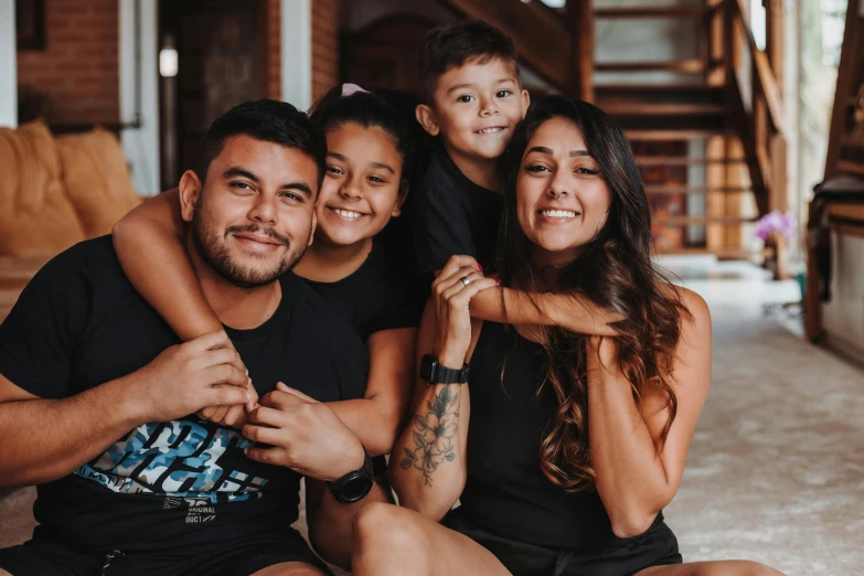 two adults and a child pose for a picture