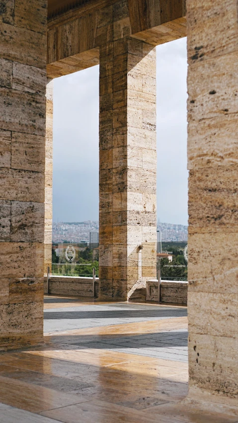 two stone columns and floor inside a building