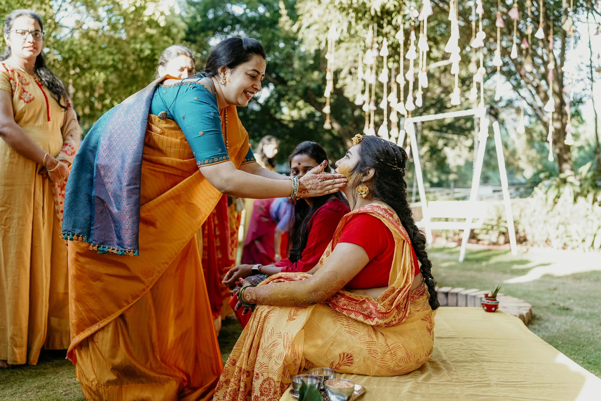 two women getting their pograph taken by an indian pographer