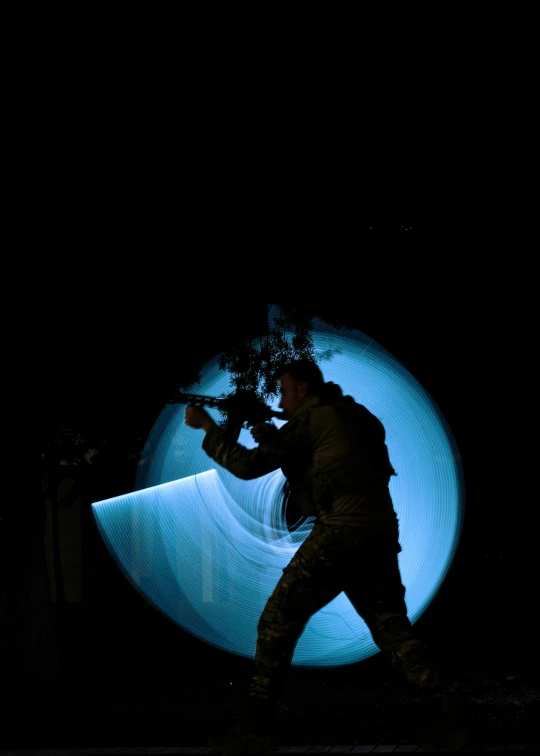 a man is walking through a tunnel in the dark