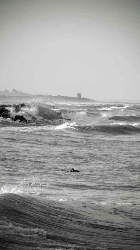a black and white po of some waves