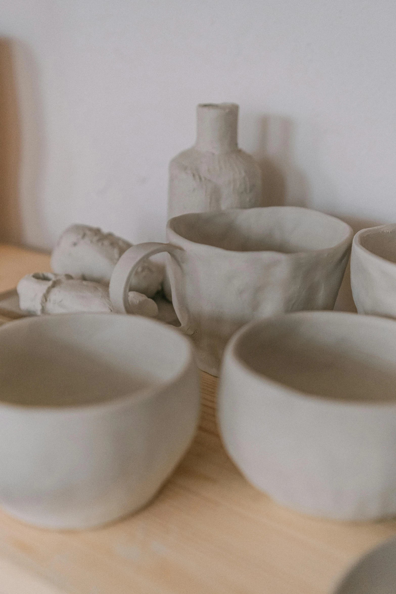 small white bowl of some sort, on a wooden counter