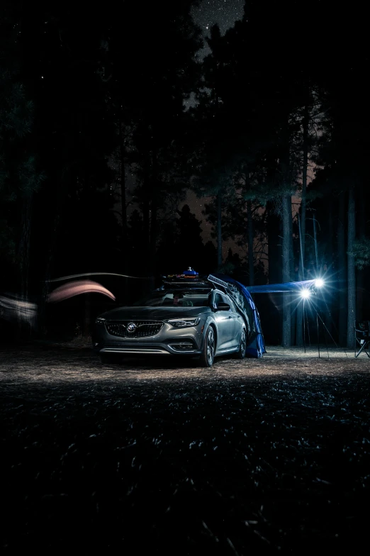 a car with an illuminated helmet is parked in the dark