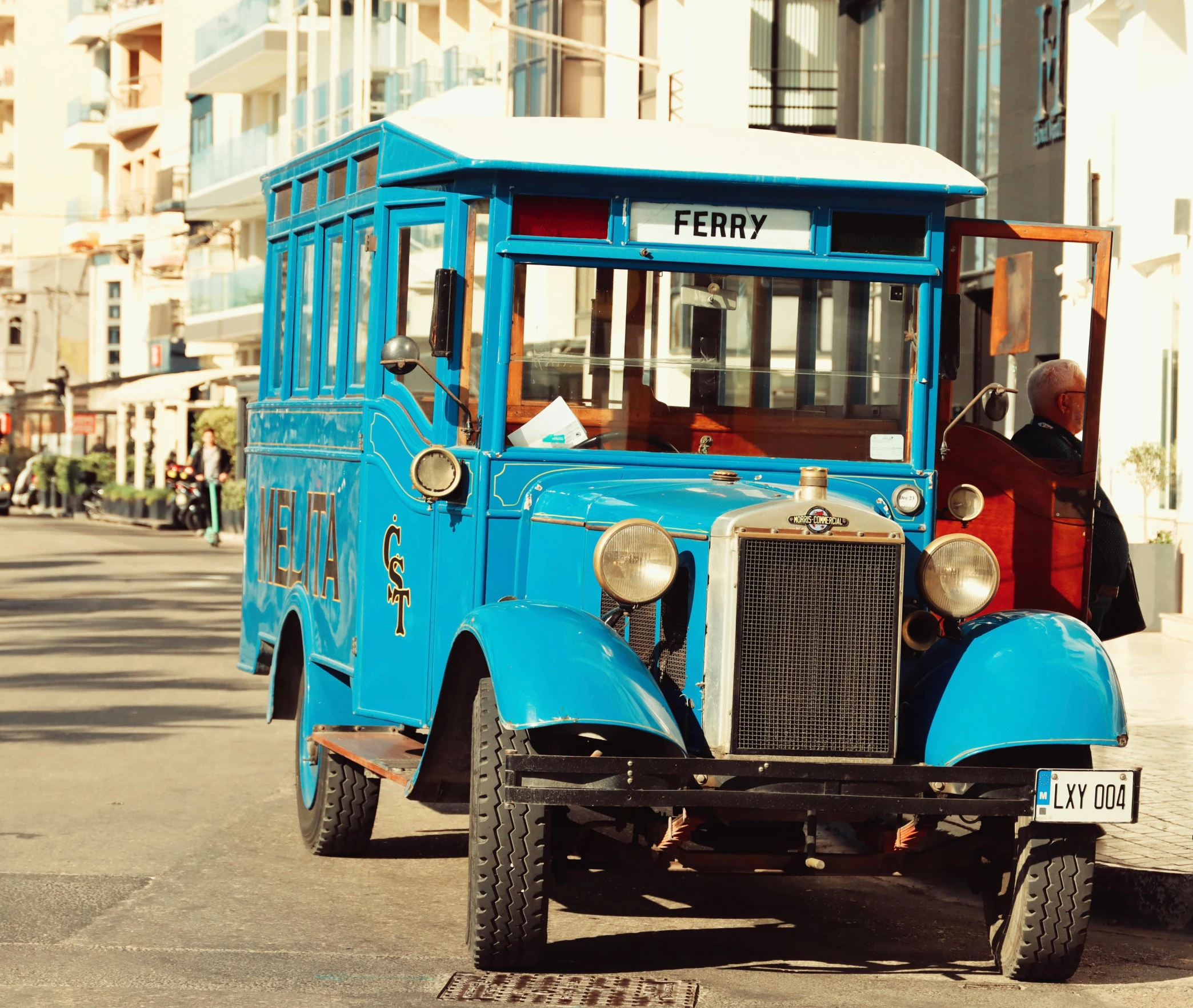 an old vintage truck is parked along the street