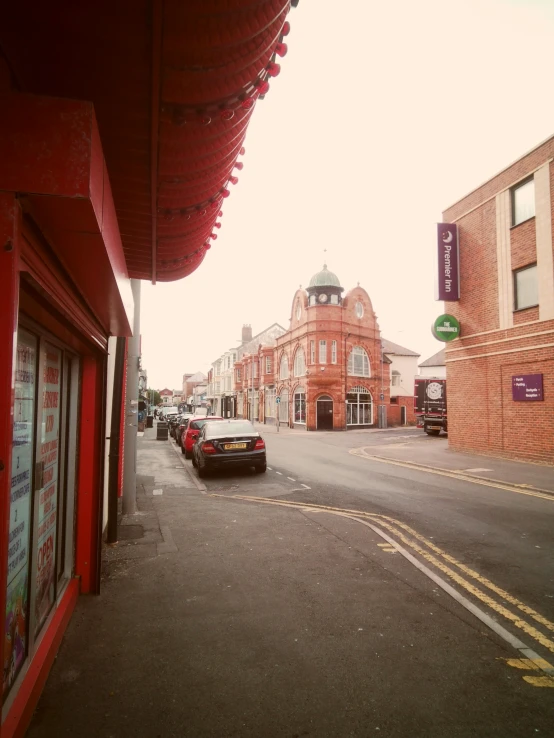 a street with many stores along it in the middle of town