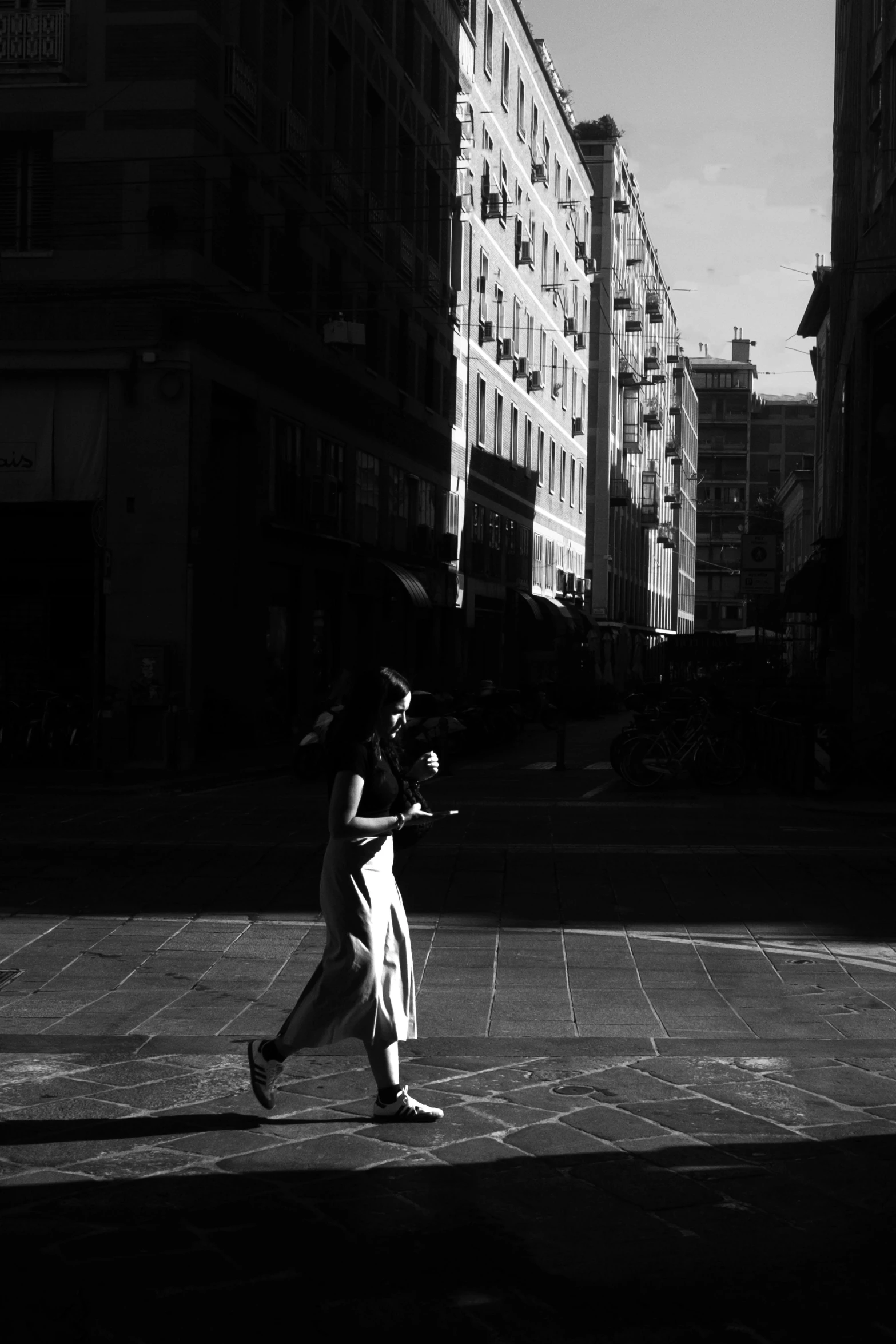 a person standing in the middle of a city