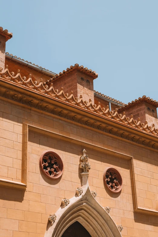 an ancient building made out of beige brick