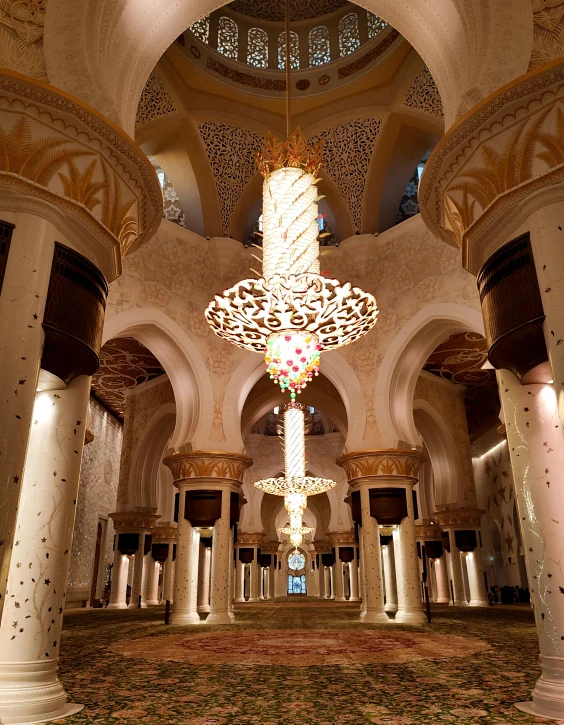 a large building with a chandelier hanging from the ceiling