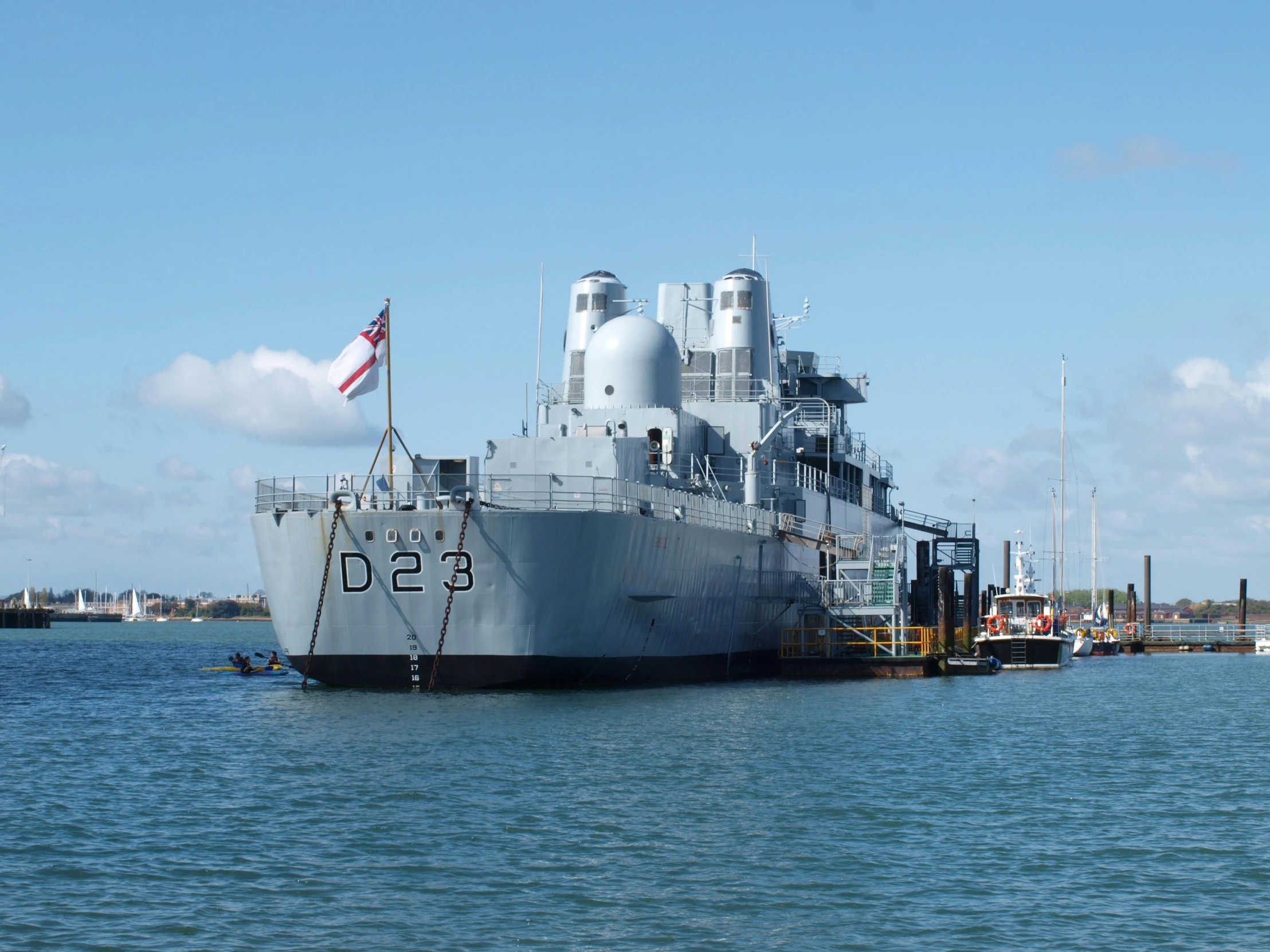 a large gray ship on the water