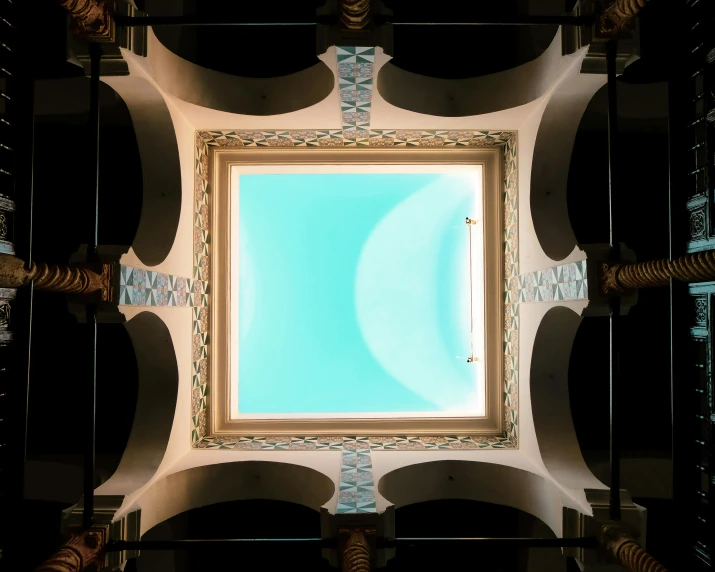 a ceiling made up of several white and blue tiles