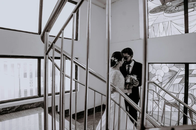 bride and groom on the stairwell at their reception