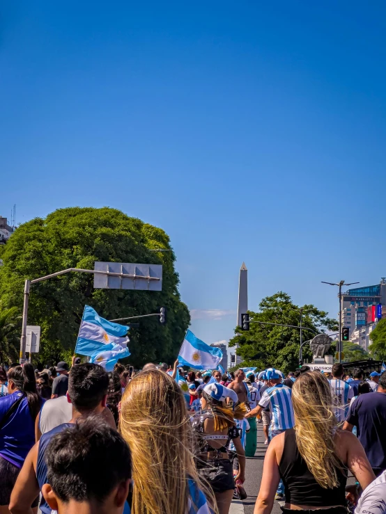 a crowd is gathering on the street