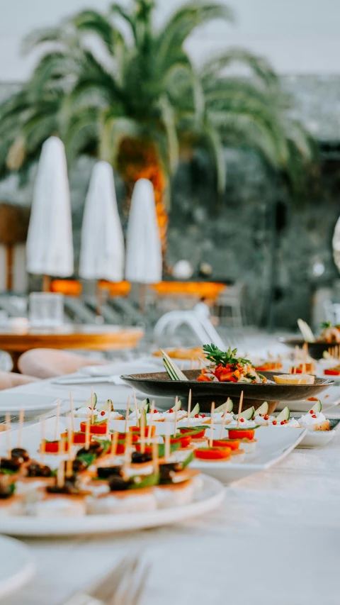 a table with several plates of different foods