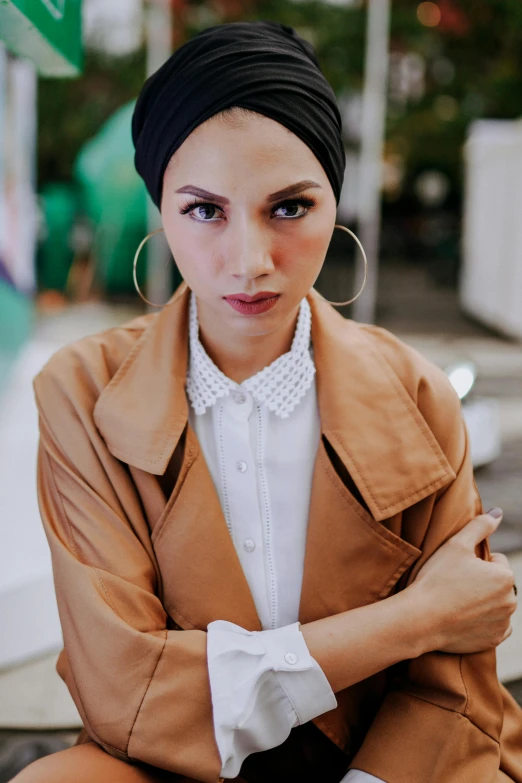 a young woman is sitting on a bench