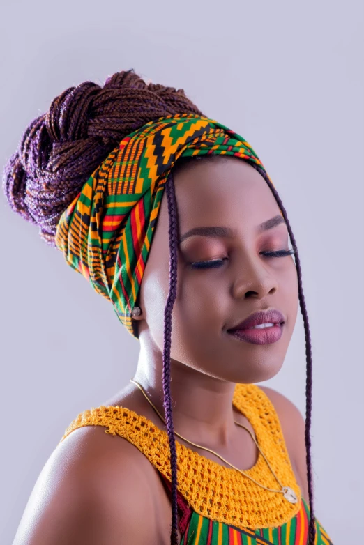 a woman in colorful dress and head wrap