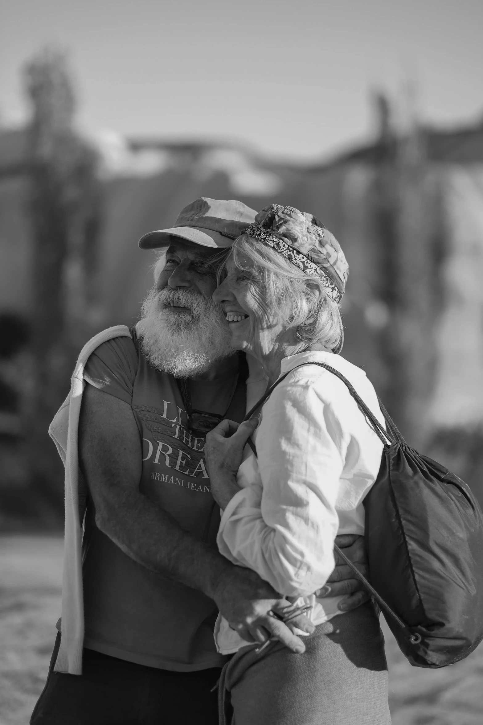 black and white pograph of man and woman emcing each other