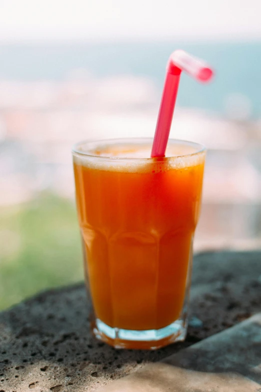 the drink is placed on a rock outside