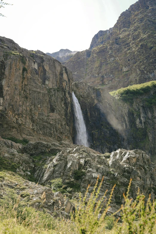 a waterfall cascading into the side of a mountain