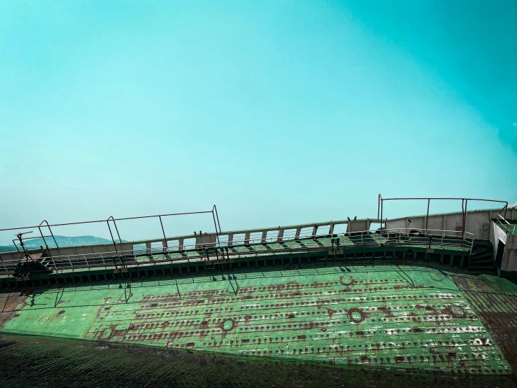 a couple of benches at the top of a large wall