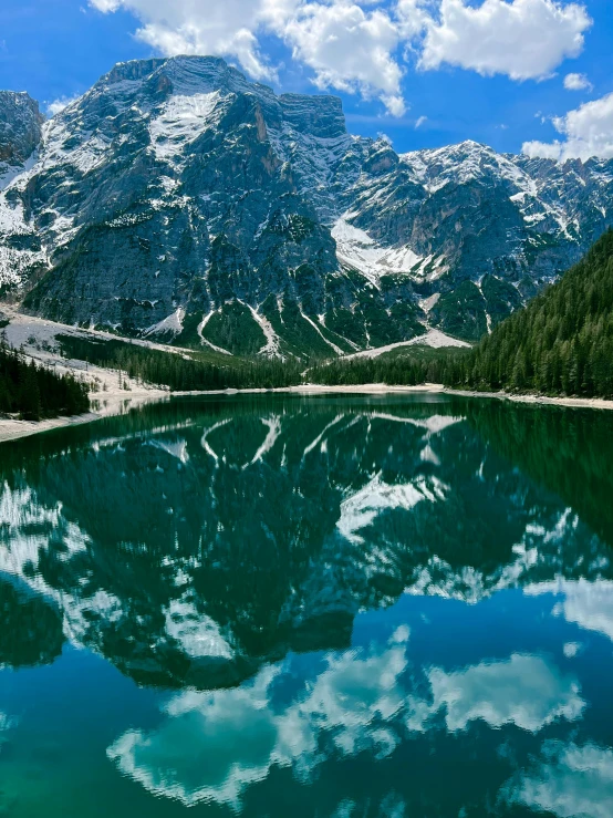 mountains reflected in a lake with clear water