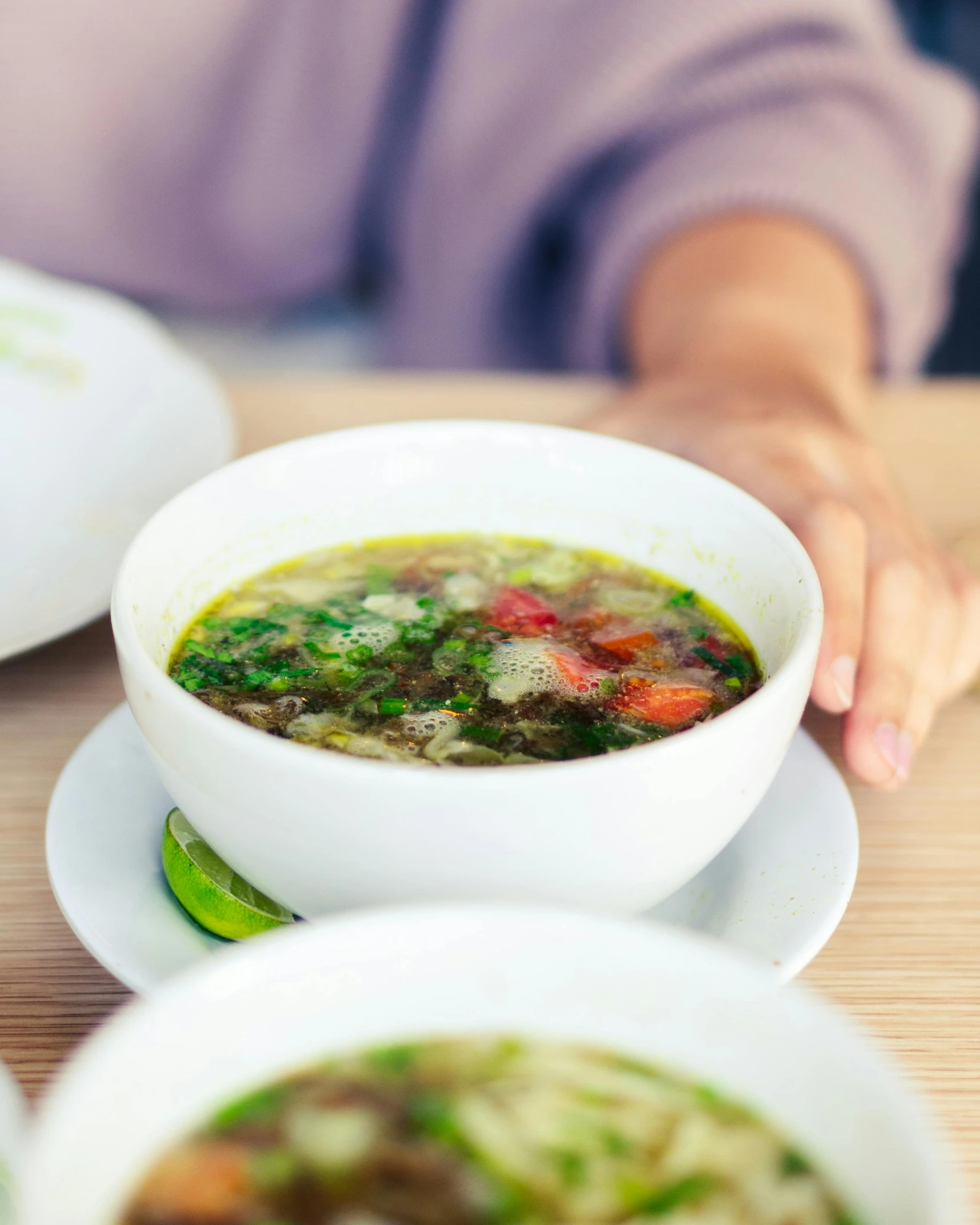 a close up of a bowl of food on a table