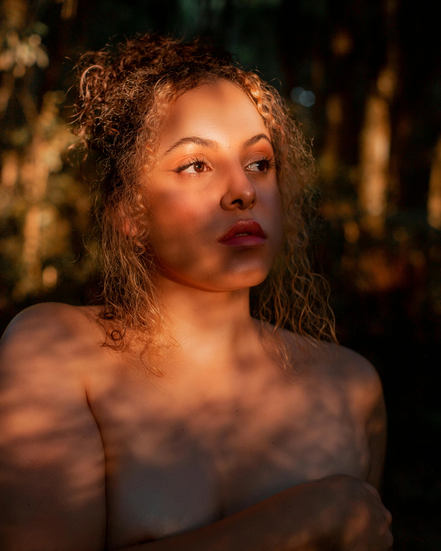 a close up of a woman looking in the opposite direction of the camera