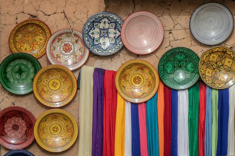 a bunch of colorful plates sitting next to each other