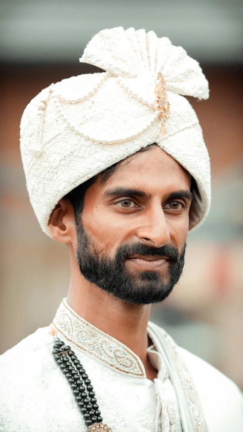 man in white outfit with a white hat