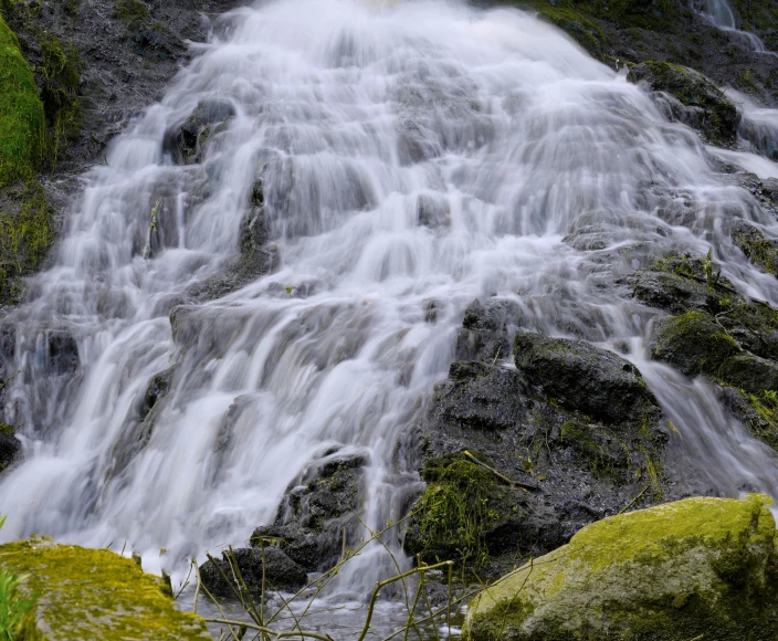 a close up of a waterfall, with very little water running over it