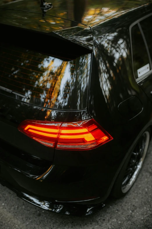 the back end of a car with its lights on