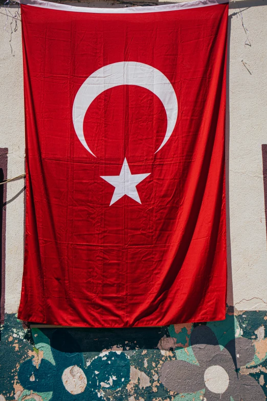 a flag hangs on the outside of a building